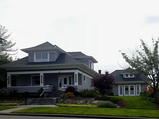 A Craftsman house with a converted garage serving as a backyard cottage